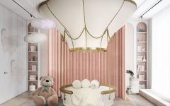 Adorable pink-toned bedroom with a unique bed resembling a hot air balloon.