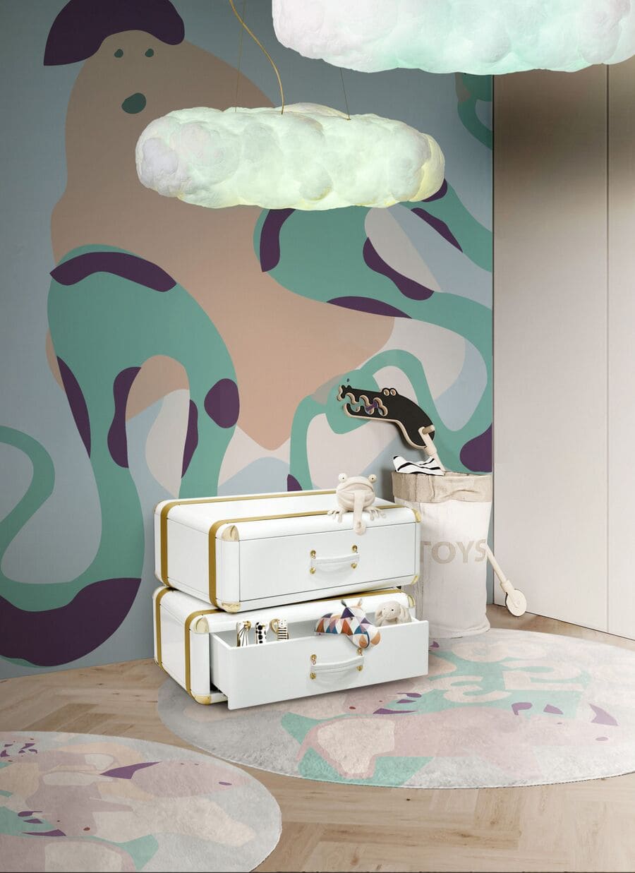 A modern kids' room corner with a luxury kids' nightstand and cloud-shaped suspension lamps.