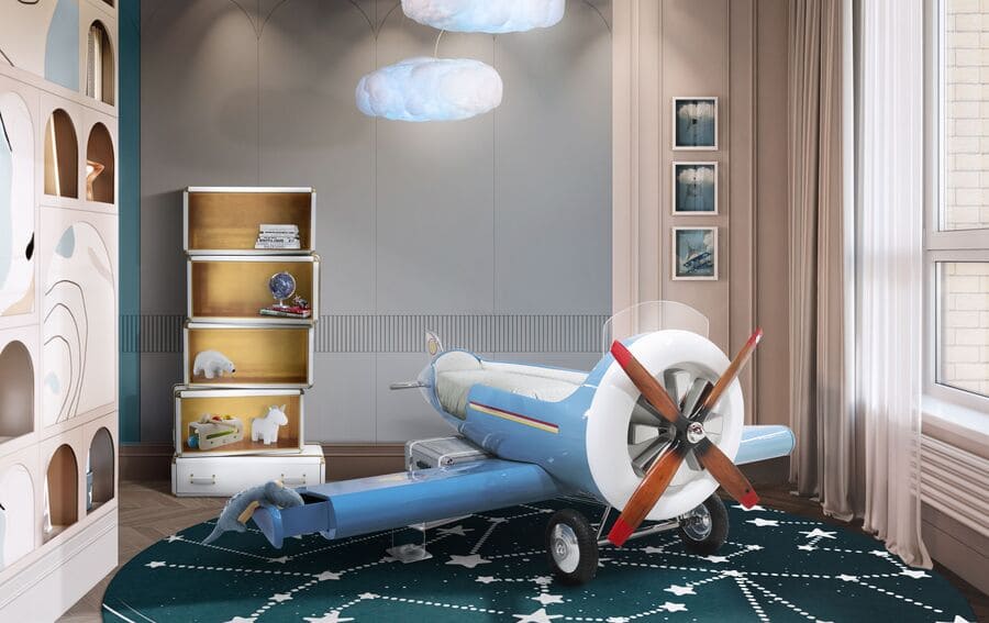 The Sky One Plane is an airplane-themed kids' bed with a playful design that it’s both didactic and fun. An airplane-inspired decoration for luxury kids' rooms is perfect to encourage the little explorers to develop their creativity. The body is entirely made of fiberglass with glossy varnish applied and chrome plated finishes in the engine and wheels. The decorative suitcases include secret storage compartments and allow easy access to the bed. The Sky One Plane makes the crib-to-bed transition as painless as possible.